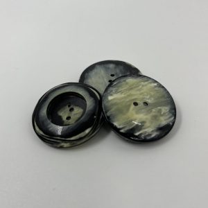 Coat button, resin, strikimg contrasting marbling colours with sunken centre
