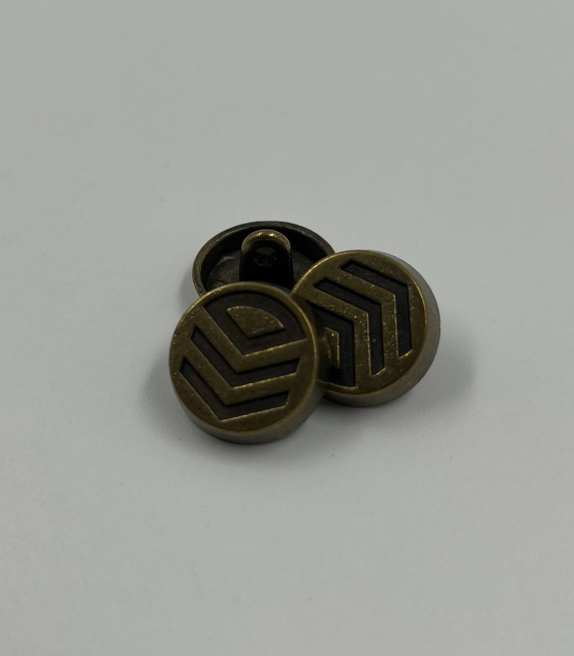 Coat button metal with chevron design