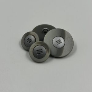 Coat button metalic finish with inserted design