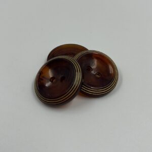 Coat button resin transparent walnut coloured with gold ringed border