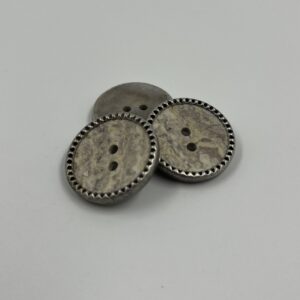 Coat button metal with a marble effect centre