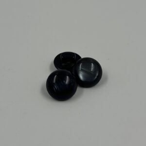 Shirt button, domed black with slight colour variations