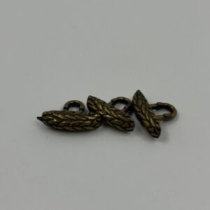 Shirt button, metal antique brass effect with plaited design