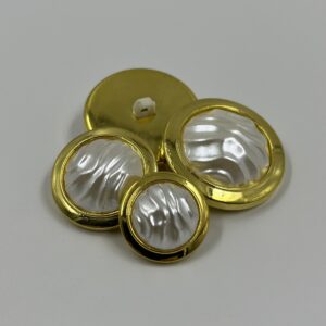 Coat button, resin, gold effect with a Baroque pearl centre
