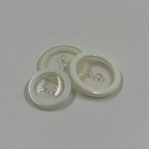 Coat button, resin, transparent with white rim