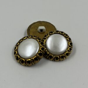 Coat button, resin, ornate gold effect border with shimmering pearl setting