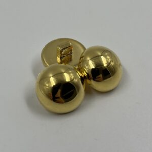 Coat button,resin, domed brass effect