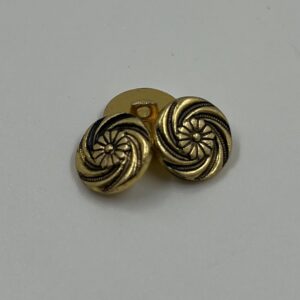 Shirt button , gold metal effect, swirl design